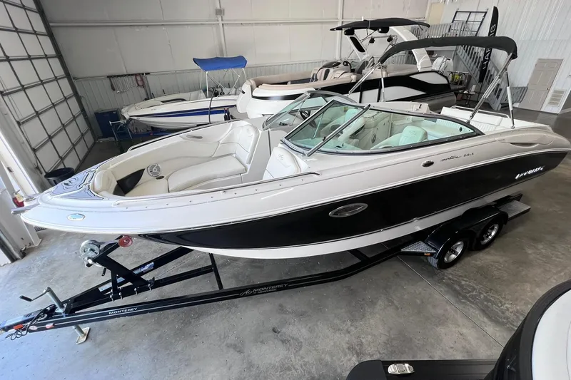 Slide: The Image of 2007 Monterey 248LS Montura Bowrider boat on trailer in showroom. - 4