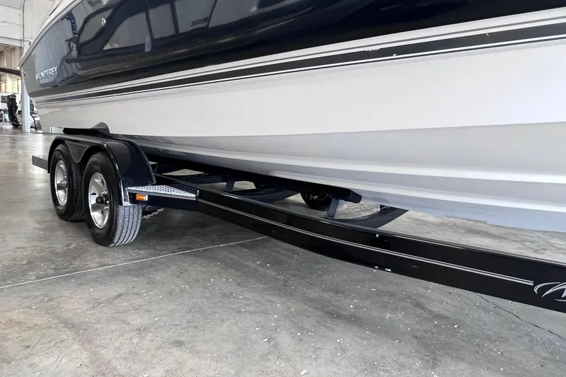 Slide: The Image of 2007 Monterey 248LS Montura Bowrider on trailer in a garage setting. - 46