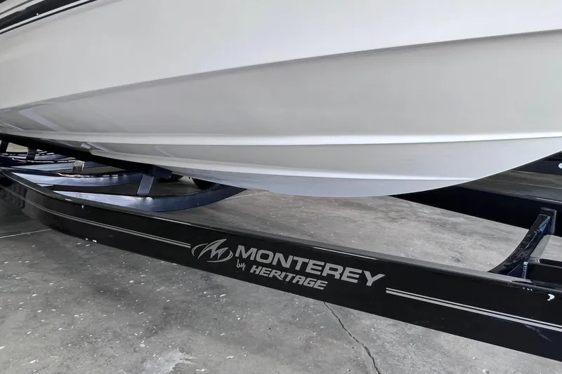 Slide: The Image of 2007 Monterey 248LS Montura Bowrider on a trailer in a garage. - 49