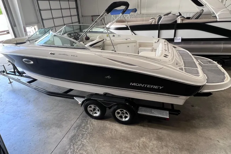 Slide: The Image of 2007 Monterey 248LS Montura Bowrider on trailer in showroom. - 5