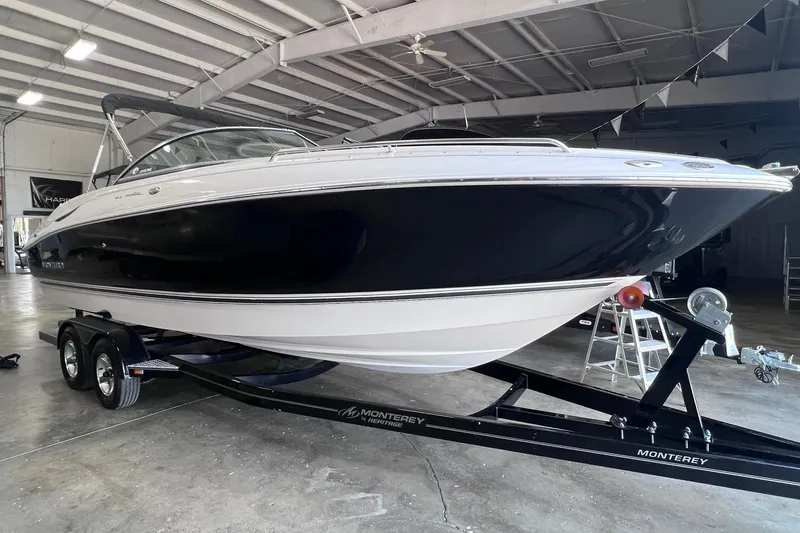 Slide: The Image of 2007 Monterey 248LS Montura Bowrider on trailer in indoor storage facility. - 6