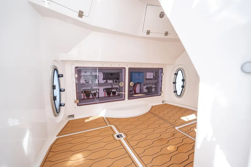 Slide: The Image of Interior of 2026 MVI Invicta 30OC boat, featuring modern equipment and sleek design. - 25