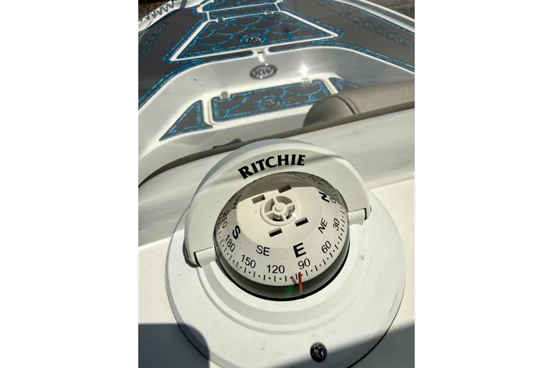 Slide: The Image of Compass on 2023 Key West 188 Bay Reef boat dashboard in sunlight. - 12