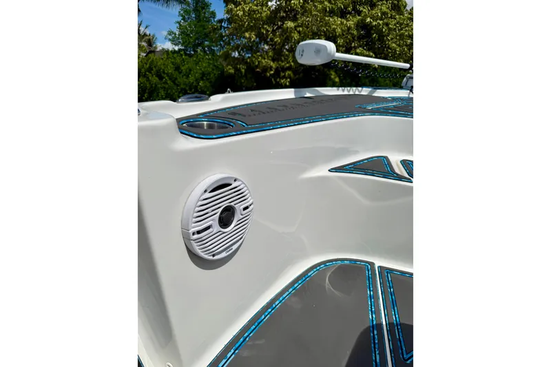 Slide: The Image of 2023 Key West 188 Bay Reef boat with speaker and blue-accented design. - 15