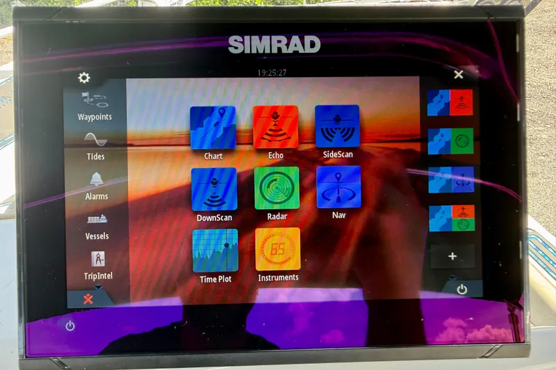 Slide: The Image of Simrad marine display on 2023 Key West 188 Bay Reef boat, showing navigation and sonar options. - 18