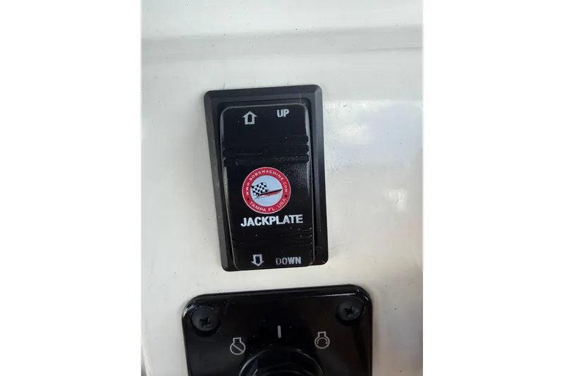 Slide: The Image of 2023 Key West 188 Bay Reef jackplate control switch with up and down arrows. - 21