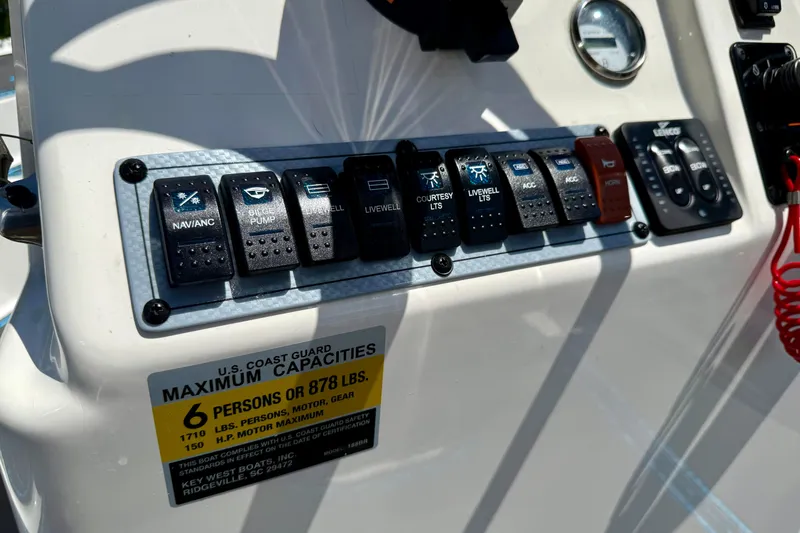 Slide: The Image of Control panel of 2023 Key West 188 Bay Reef boat with capacity label. - 25