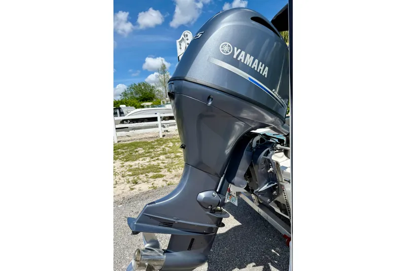 Slide: The Image of Yamaha outboard motor on 2023 Key West 188 Bay Reef boat, parked outdoors. - 34