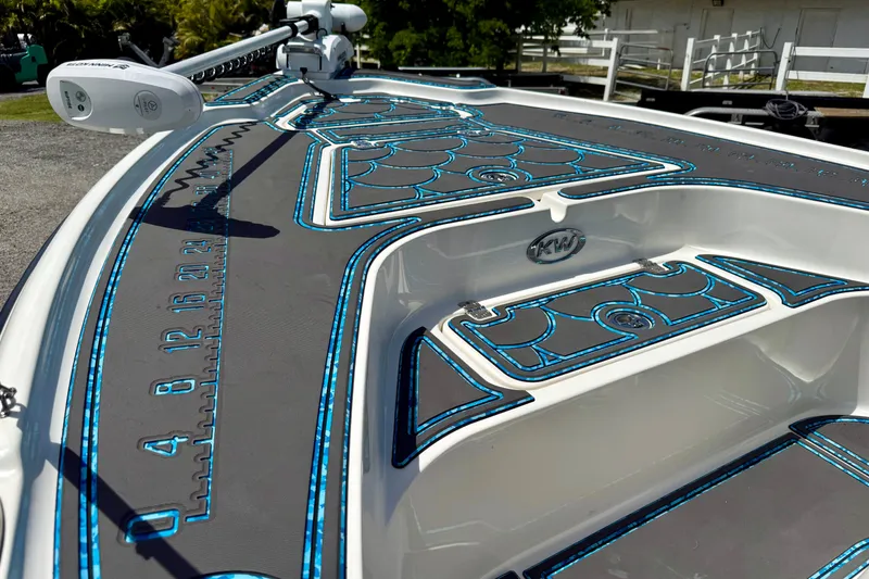 Slide: The Image of 2023 Key West 188 Bay Reef boat deck with custom blue and gray padding. - 6