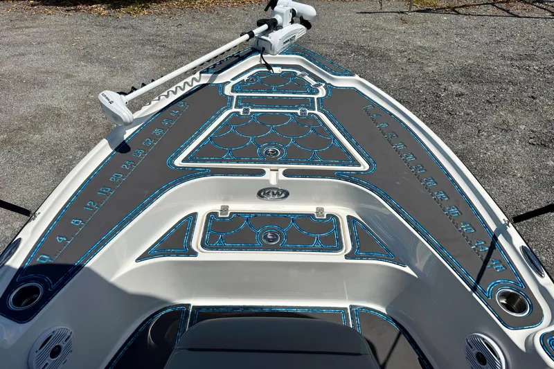 Slide: The Image of 2023 Key West 188 Bay Reef boat deck with custom blue and gray design. - 7