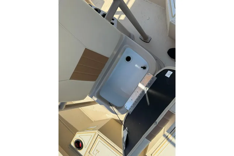 Slide: The Image of 2022 G3 Bay 18 GX boat interior with storage compartment and seating. - 14
