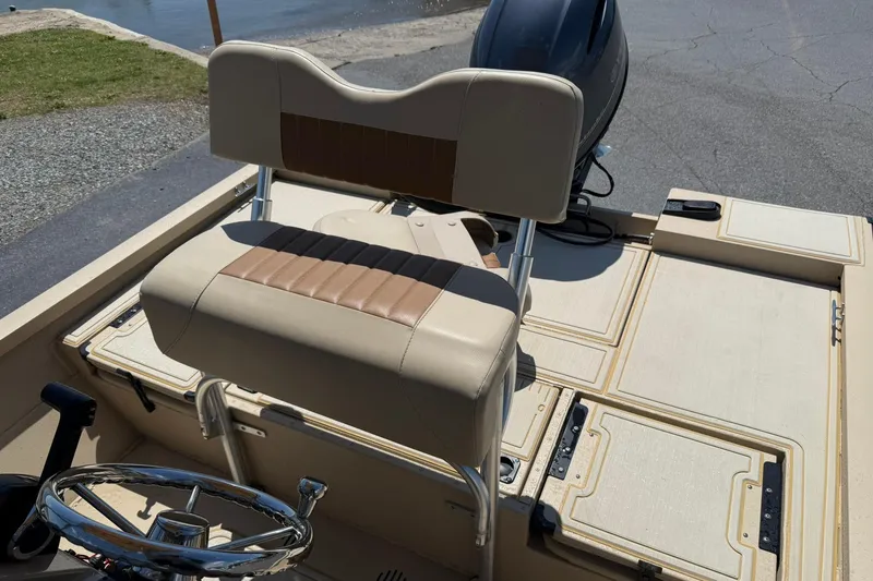 Slide: The Image of 2022 G3 Bay 18 GX boat interior with steering wheel and seating. - 15