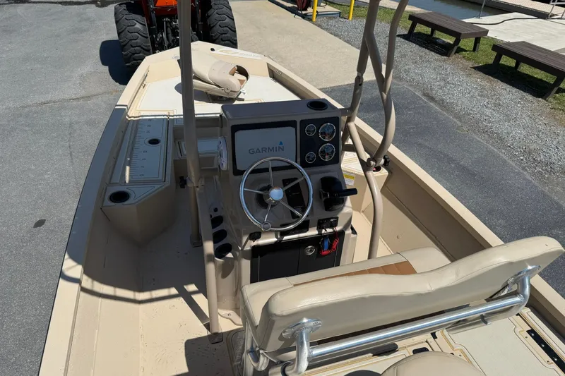 Slide: The Image of 2022 G3 Bay 18 GX boat interior with Garmin navigation system and steering wheel. - 17