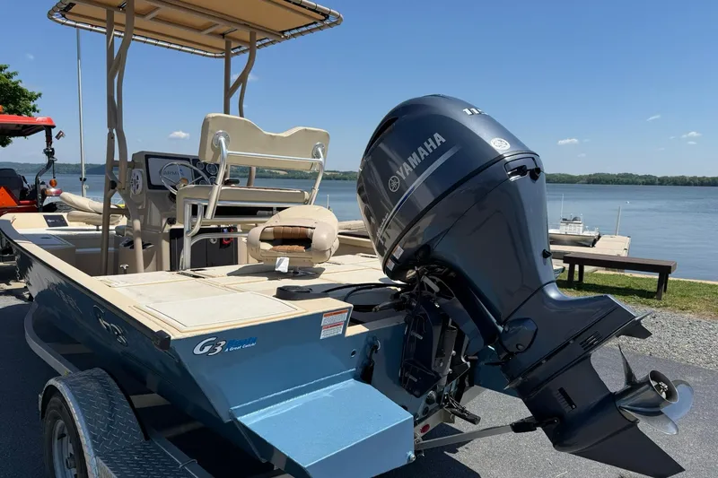 Slide: The Image of 2022 G3 Bay 18 GX boat with Yamaha motor by a lake. - 3