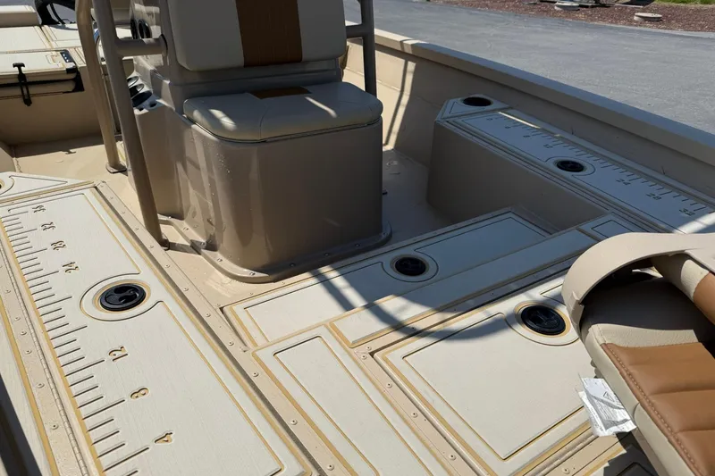Slide: The Image of 2022 G3 Bay 18 GX boat interior with seating and measurement markings. - 8