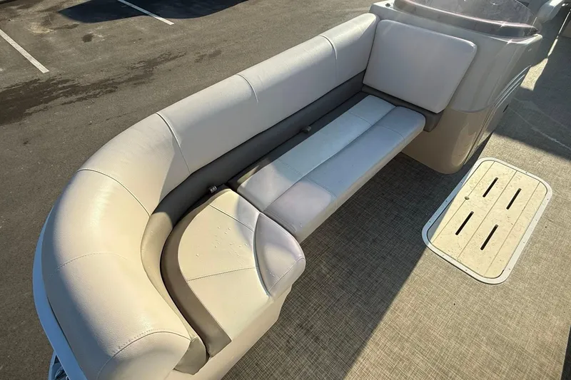 Slide: The Image of 2019 SunCatcher V322 Cruise boat with beige seating and deck view. - 10