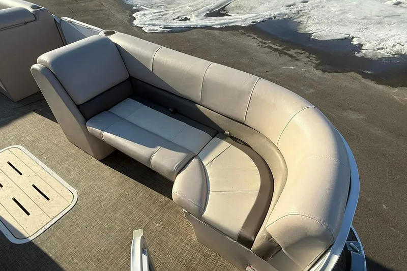 Slide: The Image of 2019 SunCatcher V322 Cruise boat with beige seating on a sunny day. - 11