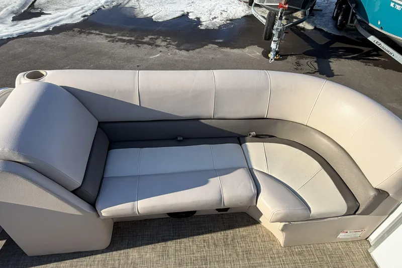 Slide: The Image of Luxurious seating on 2019 SunCatcher V322 Cruise boat, featuring plush beige upholstery. - 12