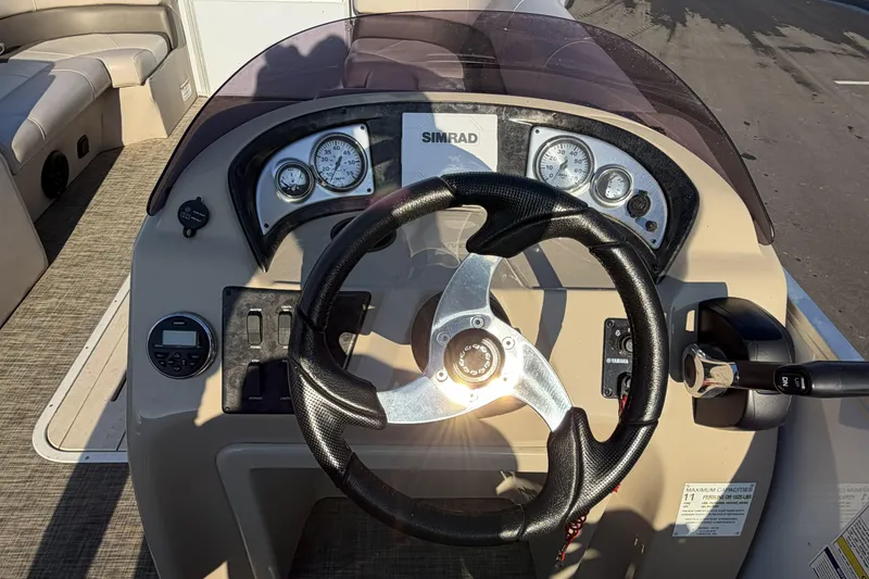 Slide: The Image of Steering console of 2019 SunCatcher V322 Cruise boat with gauges and controls. - 16