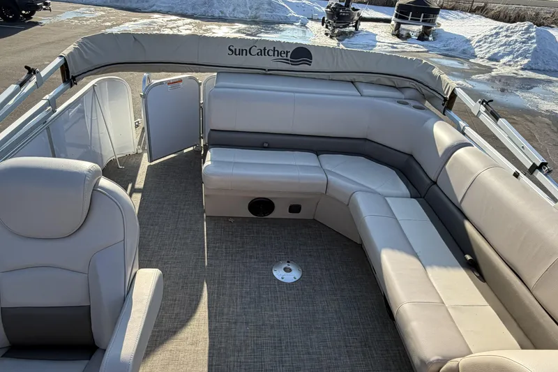 Slide: The Image of 2019 SunCatcher V322 Cruise pontoon boat interior with spacious seating and elegant design. - 22