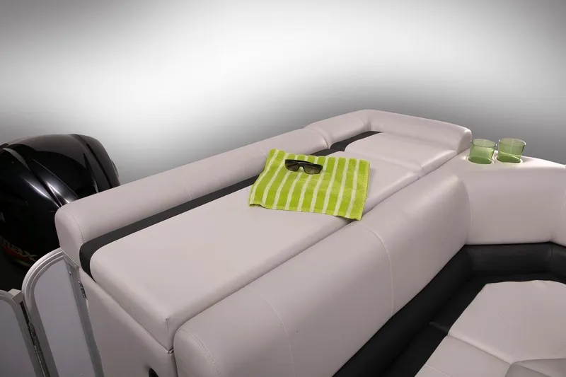 Slide: The Image of Manufacturer Provided Image: 2019 SunCatcher V322 Cruise boat interior with white seating, green towel, and sunglasses. - 27