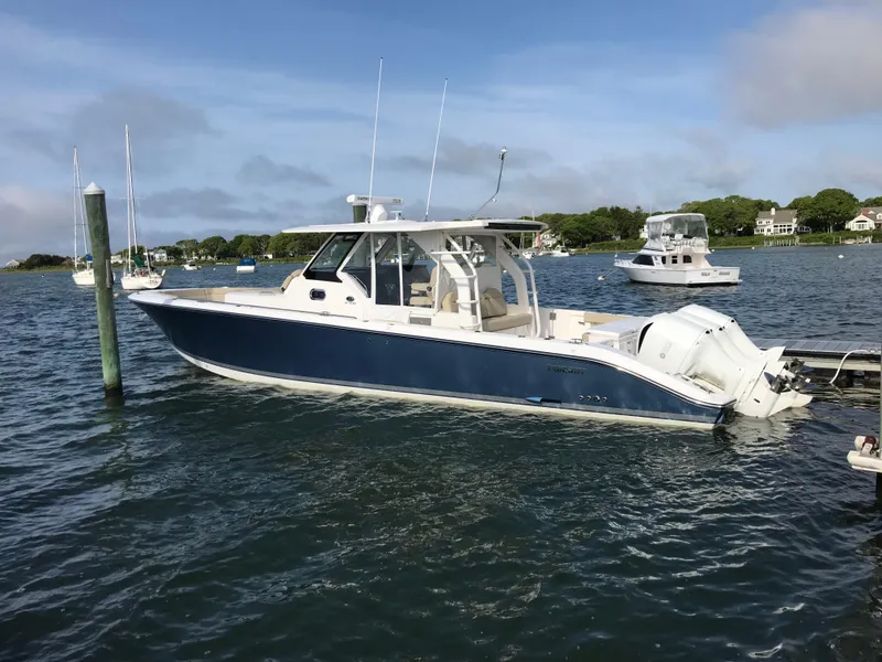 The Image of 2017 Pursuit S 408 Sport boat on water, side view. - 0