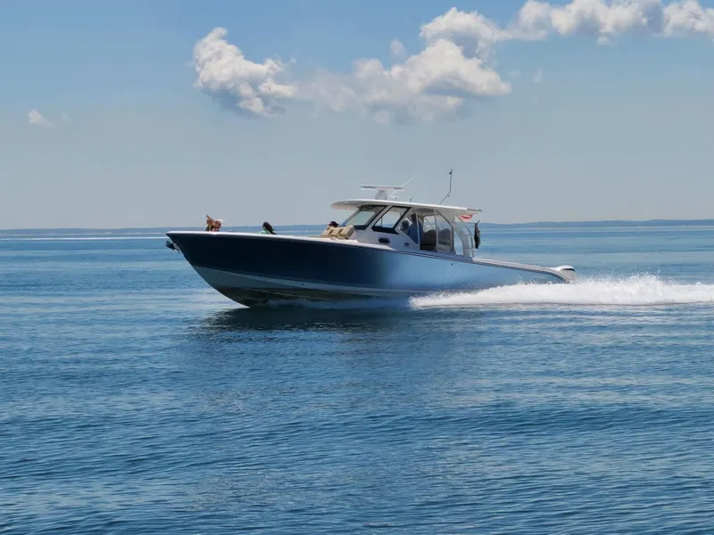 Slide: The Image of 2017 Pursuit S 408 Sport boat cruising on calm water. - 3