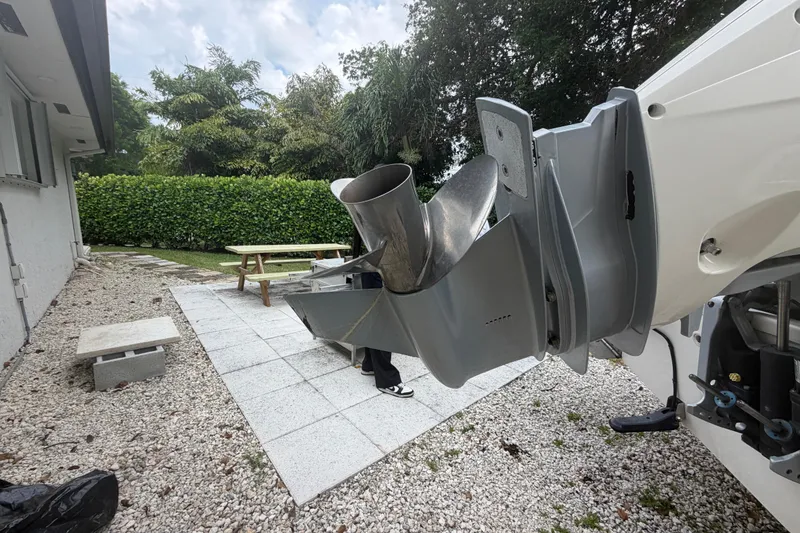 Slide: The Image of Boston Whaler 210 Dauntless 2019 boat propeller in a backyard setting. - 10