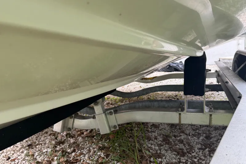 Slide: The Image of 2019 Boston Whaler 210 Dauntless boat hull on trailer, close-up view. - 15