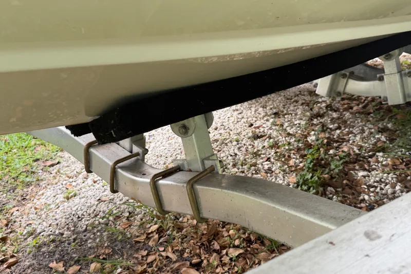 Slide: The Image of 2019 Boston Whaler 210 Dauntless boat on trailer, close-up view. - 16