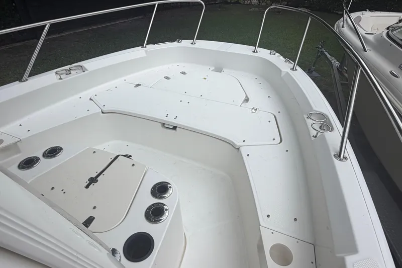 Slide: The Image of 2019 Boston Whaler 210 Dauntless boat interior with seating and stainless steel railings. - 21