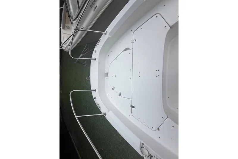 Slide: The Image of 2019 Boston Whaler 210 Dauntless boat deck with stainless steel railings. - 22