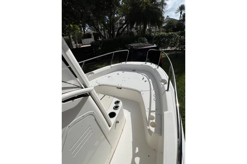 Slide: The Image of 2019 Boston Whaler 210 Dauntless boat deck with seating and cup holders. - 3