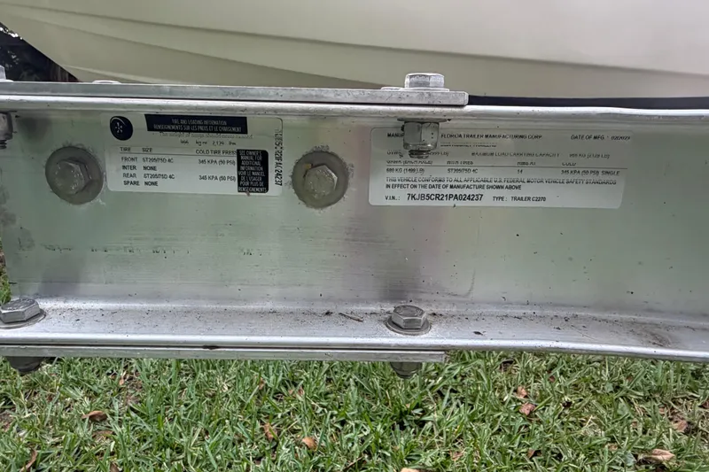 Slide: The Image of Trailer label for 2019 Boston Whaler 210 Dauntless, showing tire and load specifications. - 7