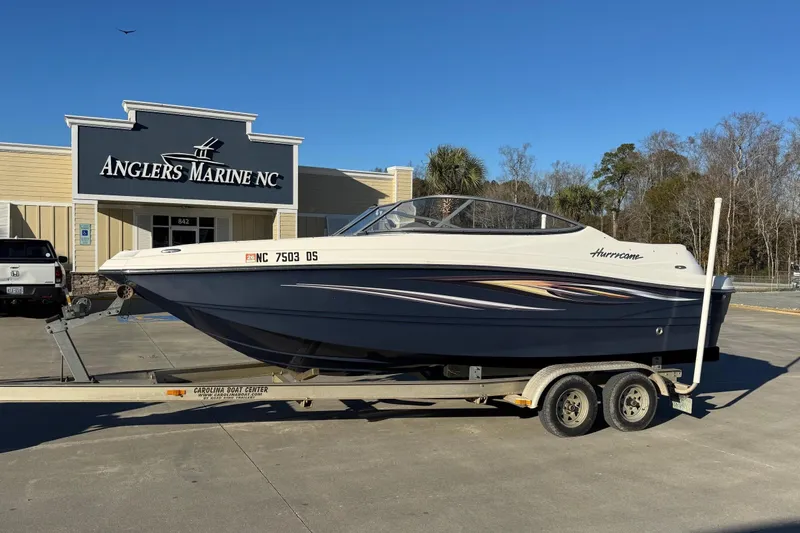 The Image of 2009 Hurricane SunDeck 210 IO boat on trailer at Anglers Marine NC dealership. - 0