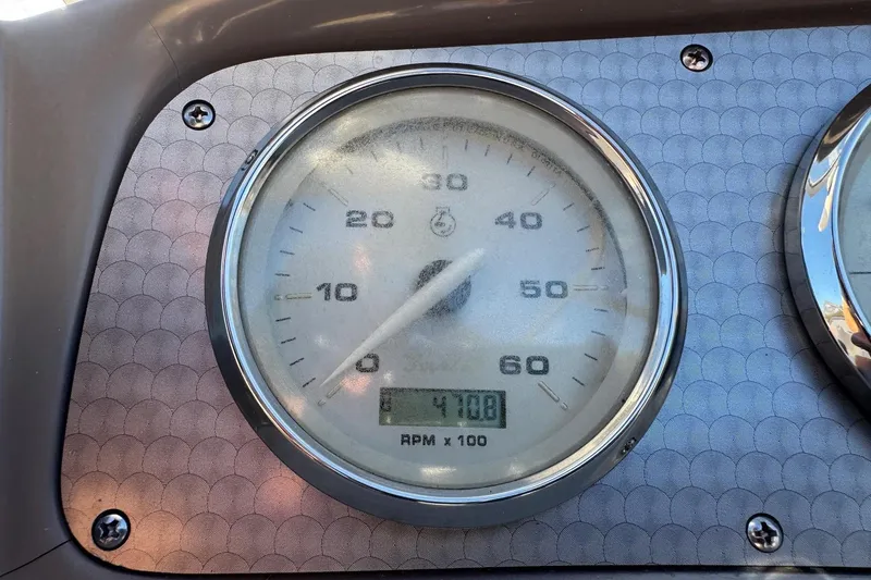 Slide: The Image of Close-up of a 2009 Hurricane SunDeck 210 IO speedometer showing 4710.8 RPM. - 15