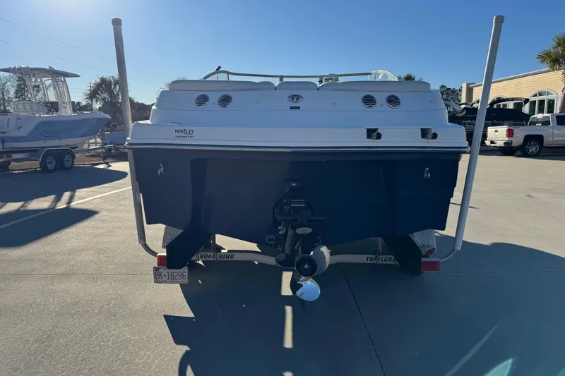 Slide: The Image of 2009 Hurricane SunDeck 210 IO boat on trailer, rear view in sunny outdoor setting. - 3