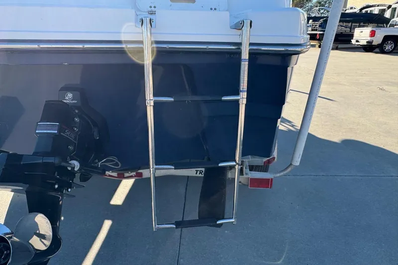 Slide: The Image of Rear view of a 2009 Hurricane SunDeck 210 IO boat with ladder and Mercury engine. - 6