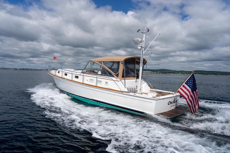 Slide: The Image of 2000 Grand Banks Eastbay 43 Ex cruising on open water. - 14