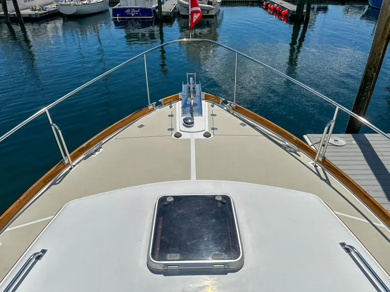 Slide: The Image of Bow view of 2000 Grand Banks Eastbay 43 Ex yacht docked in marina. - 22