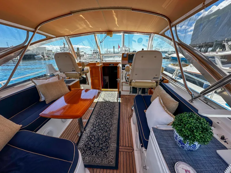 Slide: The Image of Luxurious interior of 2000 Grand Banks Eastbay 43 Ex yacht with elegant seating and helm station. - 30