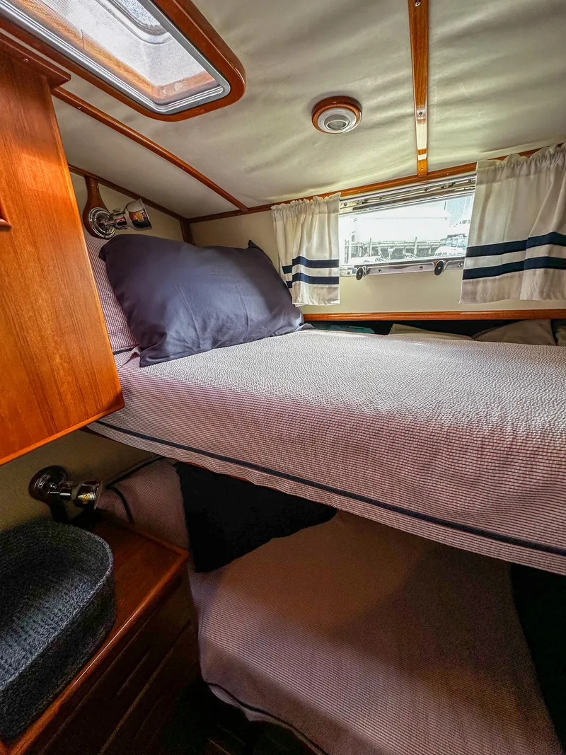 Slide: The Image of Cozy cabin interior of 2000 Grand Banks Eastbay 43 Ex with bed and window. - 41