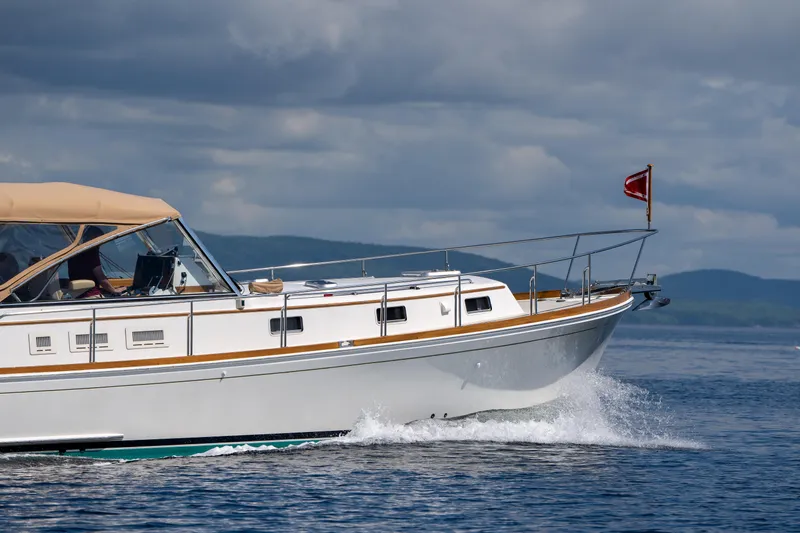 Slide: The Image of Grand Banks Eastbay 43 Ex 2000 cruising on open water. - 9