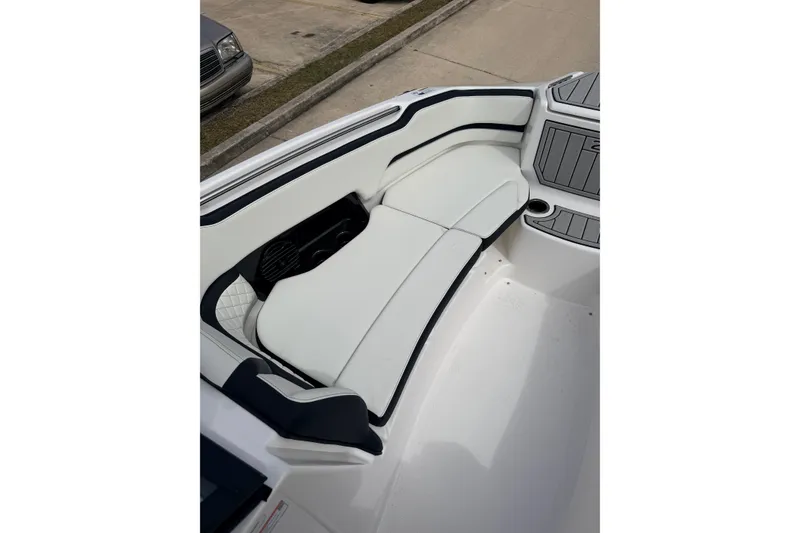 Slide: The Image of 2026 Yamaha Boats 252SD interior with white cushioned seating and sleek design. - 13