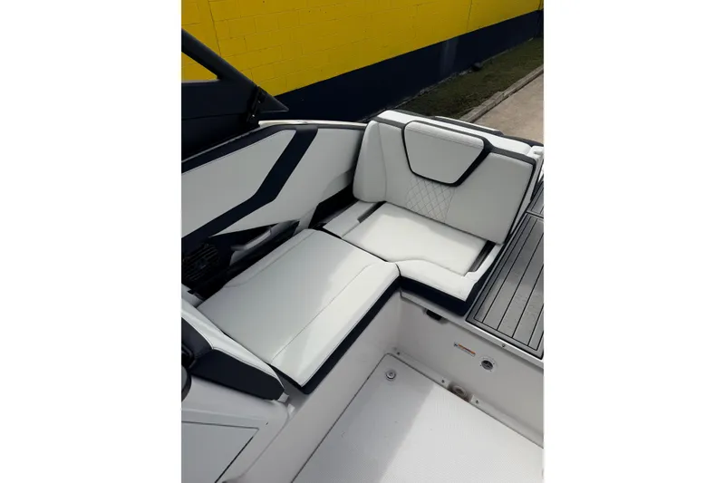 Slide: The Image of 2026 Yamaha Boats 252SD interior seating with modern design and white upholstery. - 16