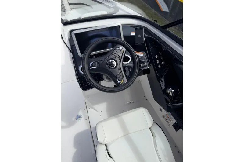 Slide: The Image of 2026 Yamaha Boats 252SD cockpit with steering wheel and control panel. - 18