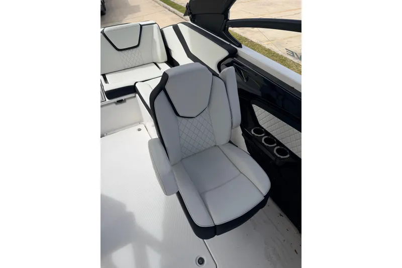 Slide: The Image of 2026 Yamaha Boats 252SD interior seating with modern design and cup holders. - 20