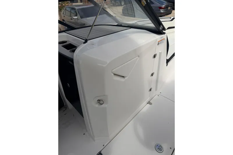 Slide: The Image of 2026 Yamaha Boats 252SD interior detail, showcasing sleek design and storage compartment. - 22
