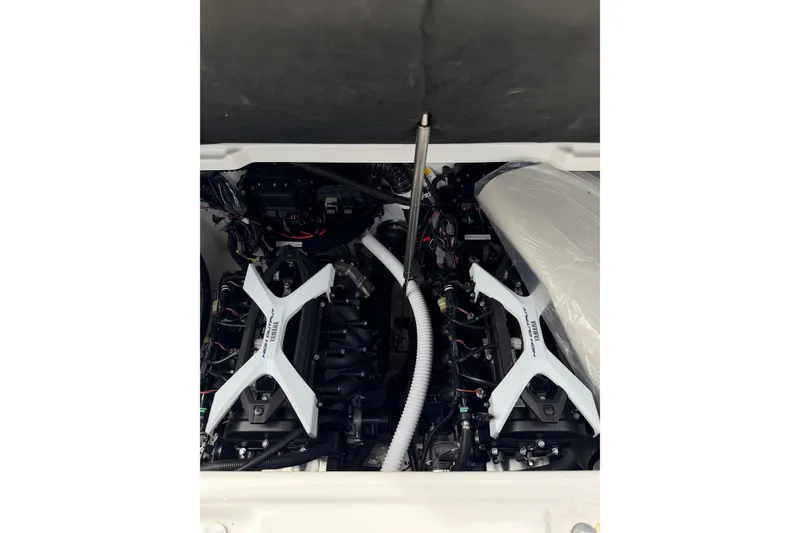 Slide: The Image of Engine compartment of 2026 Yamaha Boats 252SD, showcasing dual engines and components. - 24