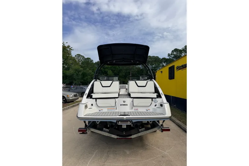 Slide: The Image of 2026 Yamaha Boats 252SD, rear view, showcasing sleek design and spacious seating. - 3
